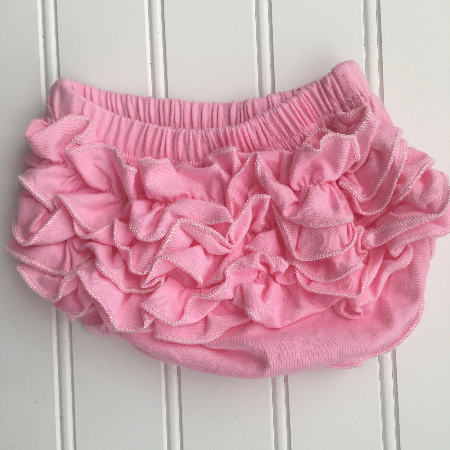 4 Colors Full Cotton Baby Bloomer with Cotton Back Ruffles. Color options are Pink, White, Cool White, and Ocean Blue. Baby Toddler