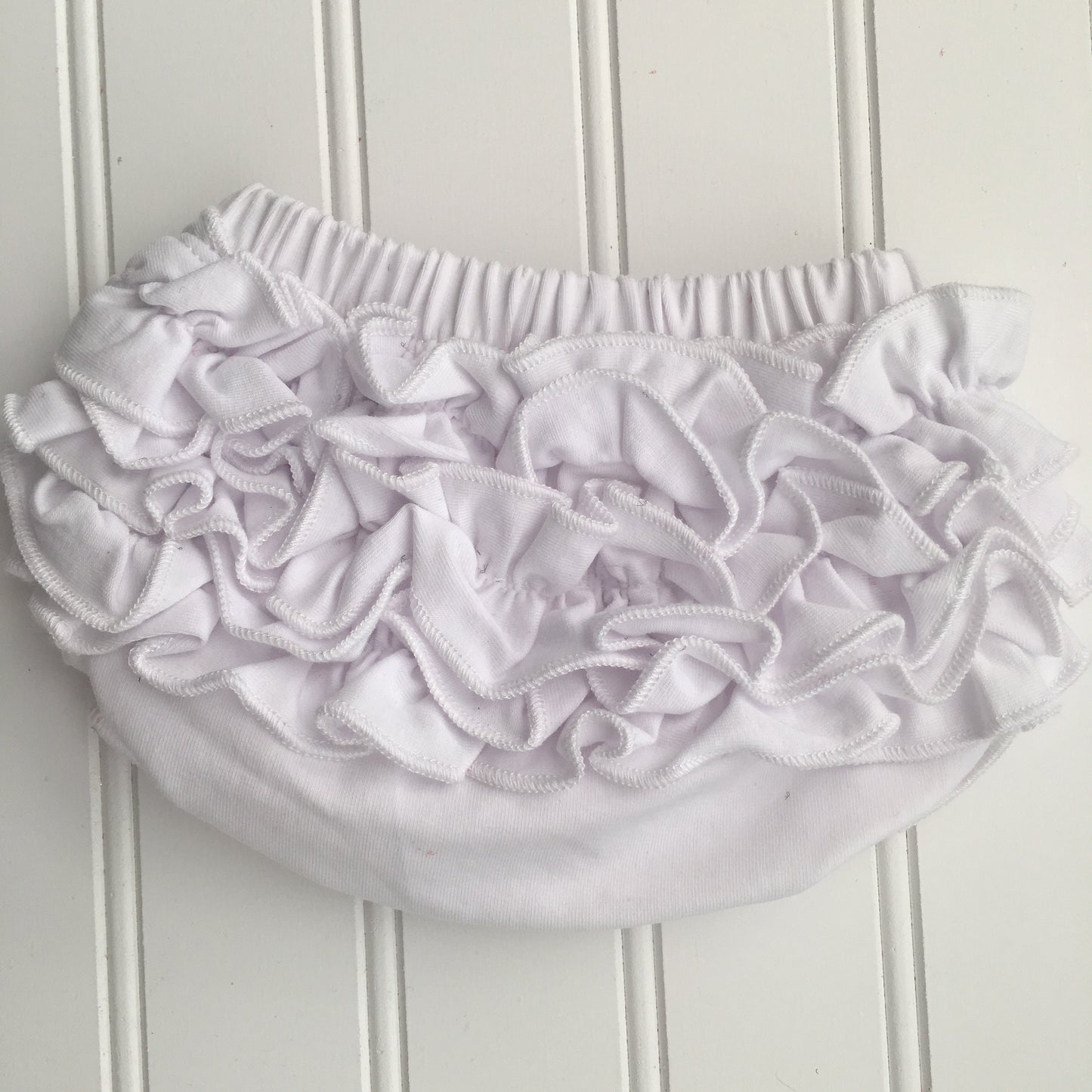 4 Colors Full Cotton Baby Bloomer with Cotton Back Ruffles. Color options are Pink, White, Cool White, and Ocean Blue. Baby Toddler